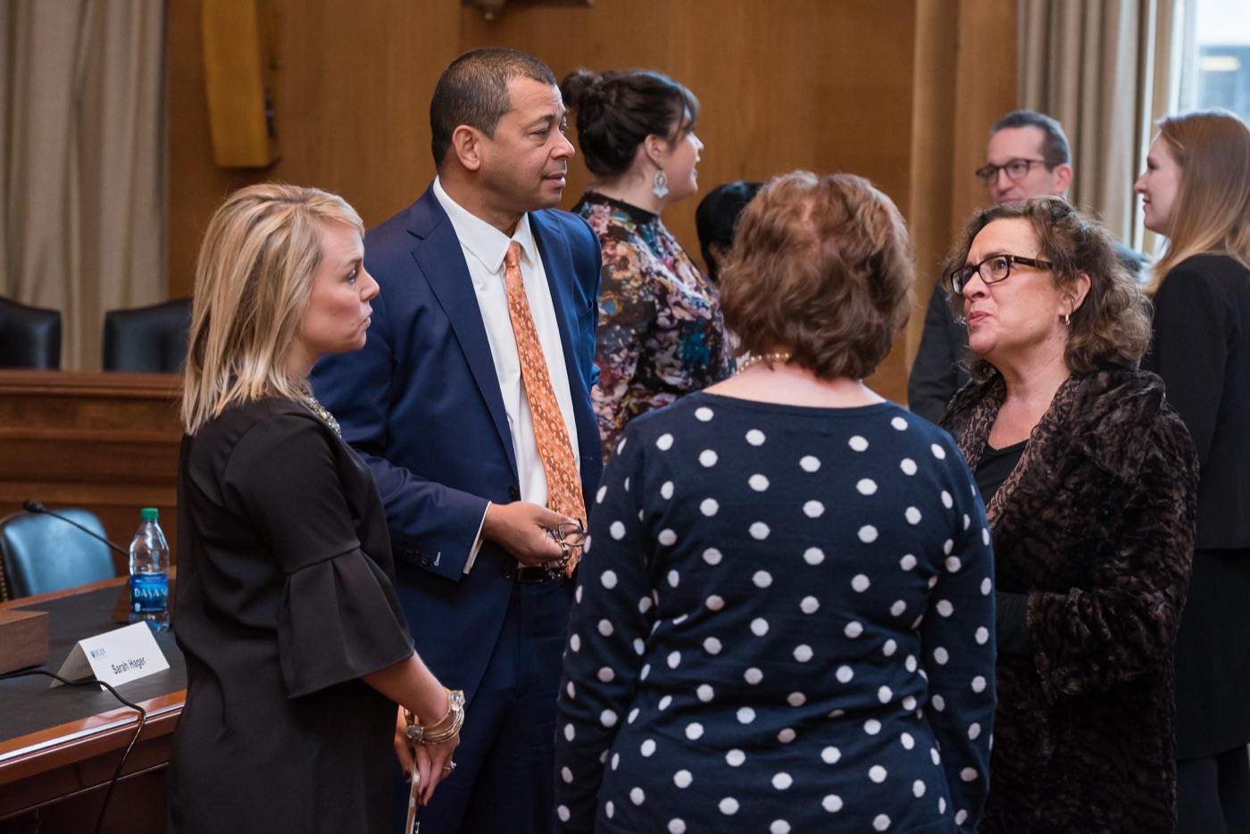 Advocates talking together in a hearing room